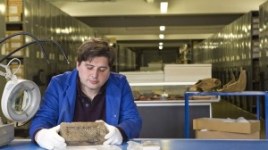 Our guide, Dan Nesbitt, looking at the brick from the Great Fire of 1666. Photo courtesy of Time Out London: http://www.timeout.com/london/attractions/london-archaeological-archive-and-research-centre-1